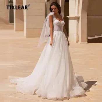 TIXLEAR Романтични сватбени рокли от тюл с пайети във формата на сърце трапецовидна форма, 2023, сватбени рокли без ръкави на бретелях с влак, направен по поръчка